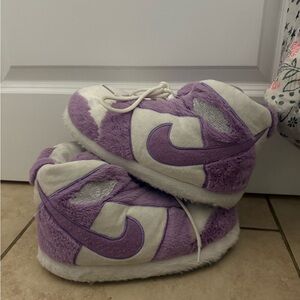 white and purple jordan’s slippers